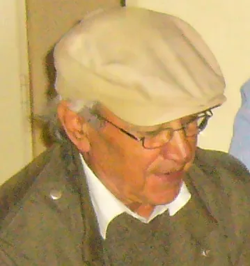 Wahib Bteddini — profile in a flat cap