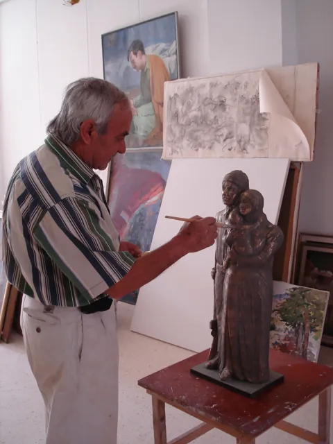 Wahib Bteddini — working beside a sculpture